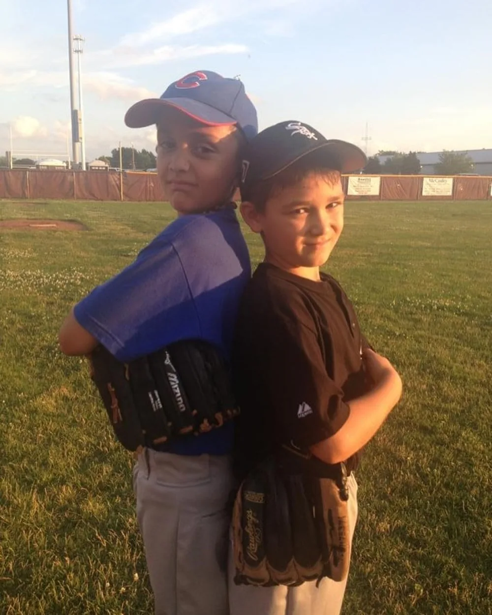 An early photograph of two boys with baseball gloves