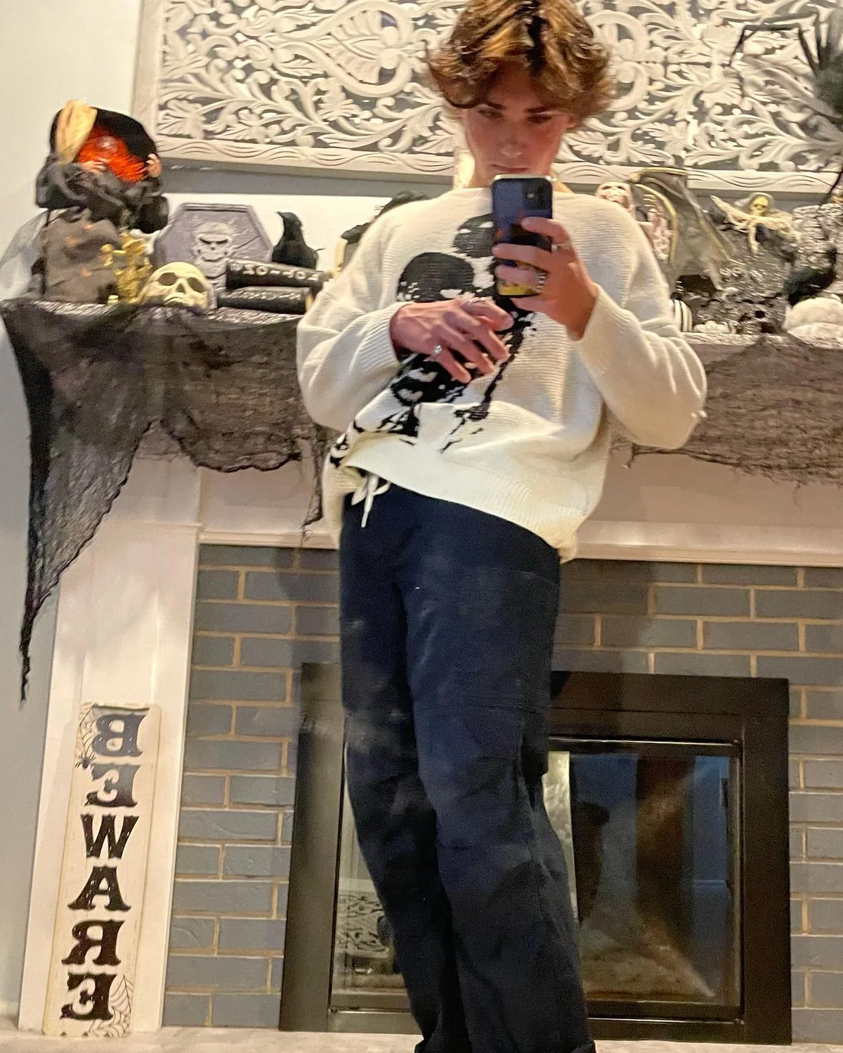 Mirror photograph in a patterned cardigan